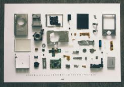 Photo by Vadim Sherbakov (Unsplash): https://unsplash.com/photos/flatlay-photography-of-camera-module-parts-osSryggkso4 Individual parts of an electronic camera spread out on a tabletop