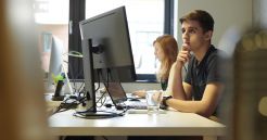 Tojio Agency Jobs Employees work at computer workstations in the digital agency.